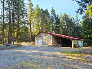 The SUPERSIZESD shop w/ attached carport
