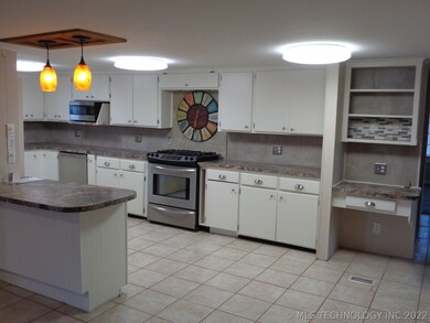 Kitchen has been updated with new ceramic flooring