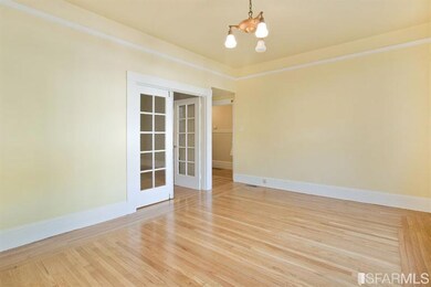 Lower unit, Living Room. French Doors lead into Fi