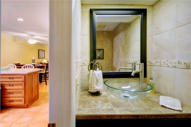 half bath just off kitchen at foyer, beautiful til