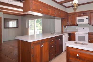 KITCHEN OPENS TO FAMILY ROOM AND SIDE DECK