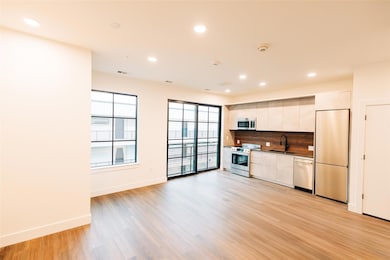 Kitchen featuring tasteful backsplash, modern cab