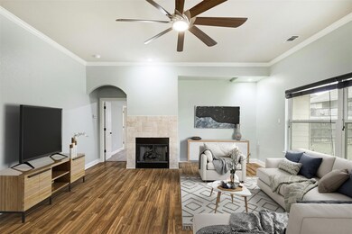 Living room with baseboards, wood finished floors