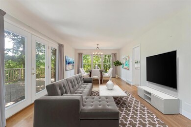 Spacious living area 1 with hardwood and entrance 