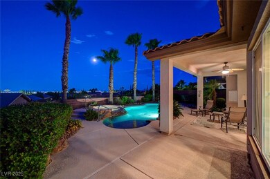 Pool at night with a patio, a ceiling fan, a pool