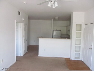 Kitchen featuring ceiling fan, white appliances, l