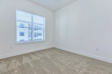 Second bedroom with walk-in closet, large window,