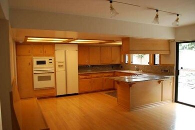 kitchen with granite counter top looking out to th