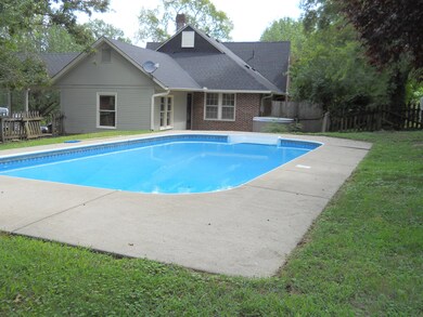 View of pool and back of house