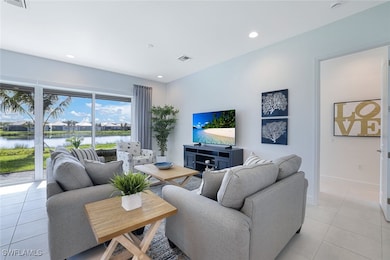 Tiled living room with a water view