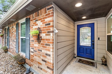 Lovely front porch entry and FUN front door!