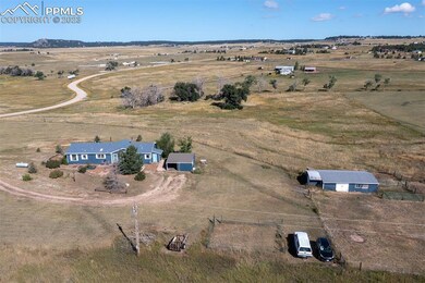 10 acres with garage/shop and barn with corrals
