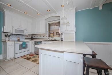 Kitchen features custom ceiling molding