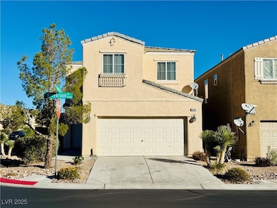 View of front facade with stucco siding, concrete driveway, and an attached garage
