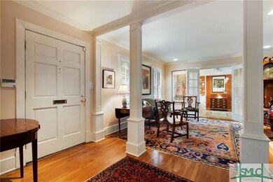The lovely front door with living room and sun por