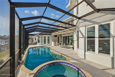 View of pool featuring french doors, a patio area, a pool with connected spa
