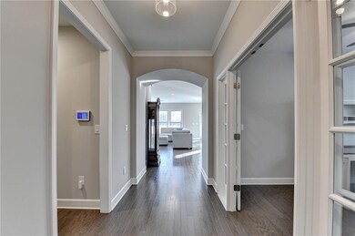 Corridor featuring dark hardwood / wood-style floo