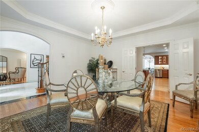 Dining room featuring crown molding, a chandelier,