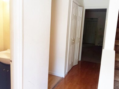 Entry with half bath storage