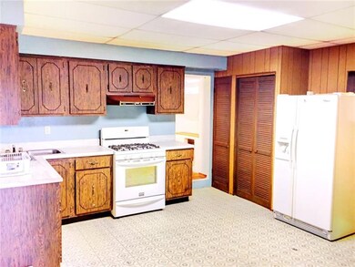 A WALL WAS REMOVED TO CREATE THE 17X14 KITCHEN PRO