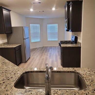 Full view of kitchen to breakfast nook.