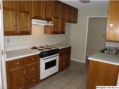Kitchen has an abundance of cabinets plus a large 