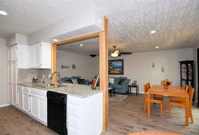Kitchen overlooks living room.