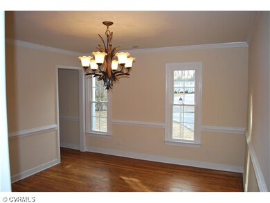 Dining Room - hardwood Flrs, Chair and Crown Mould
