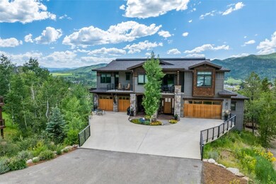 View of front facade with a balcony, a garage, con