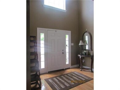 Foyer. 2-story wide foyer with wood floors welcome