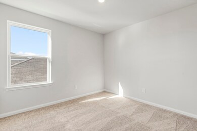 One of the three additional bedrooms in the home.