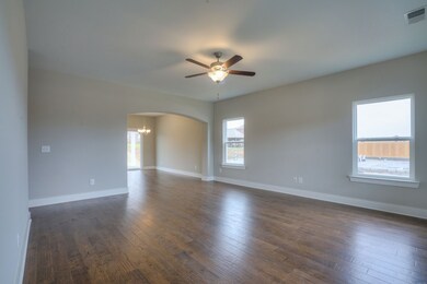 Another view of the living room looking into the dining area.  Picture of similar home.
