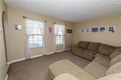 Another view of the formal living room, den, offic