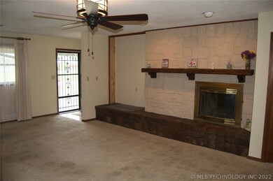 Entry way into living room with fireplace.  Very c
