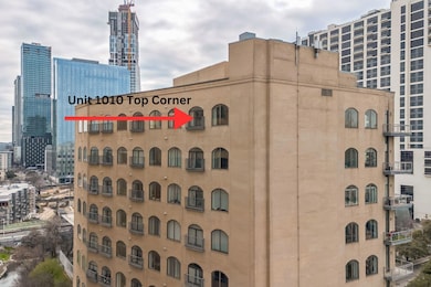 View of building exterior featuring a city view