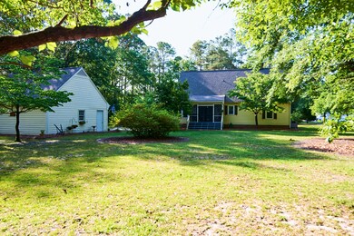 Exterior Back Long Garage and House 1