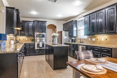 View of spacious kitchen featuring specialty cabin