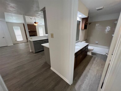 Full bathroom with ceiling fan, tub / shower combi