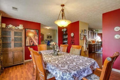 Spacious dining room next to the kitchen as your present your best meal ever to your friends.