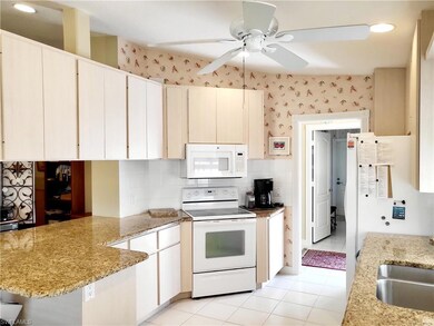 Kitchen featuring light tile patterned flooring, a