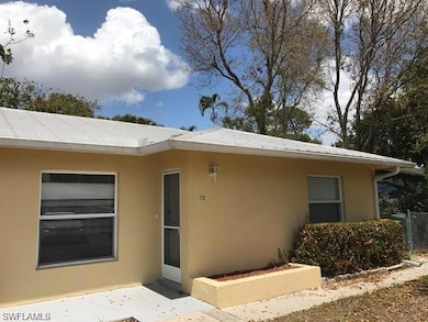 Property entrance with stucco siding