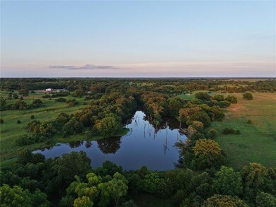 Aerial view at dusk of a water view and a forest view