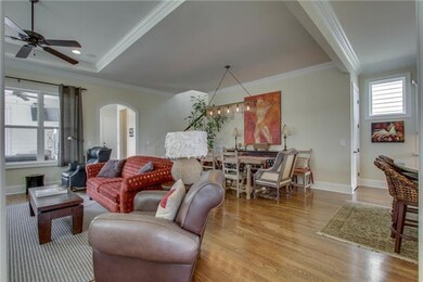 Living room opens up to dining room and kitchen