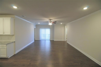 Living Room with visible vents, ceiling fan, dark 