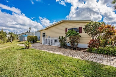 View of home's exterior with a yard