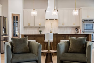 Warm and inviting open-concept living area and kitchen.