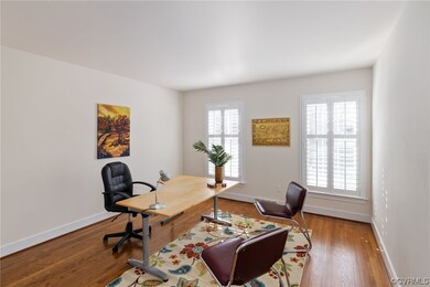 This 1st floor bedroom serves well as an office or