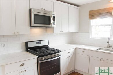 Sharp, sharp, sharp-white on-white kitchen!