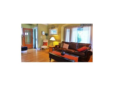 Living room with front door entrance, crown moldin