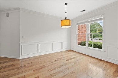 Unfurnished dining area with visible vents, orname